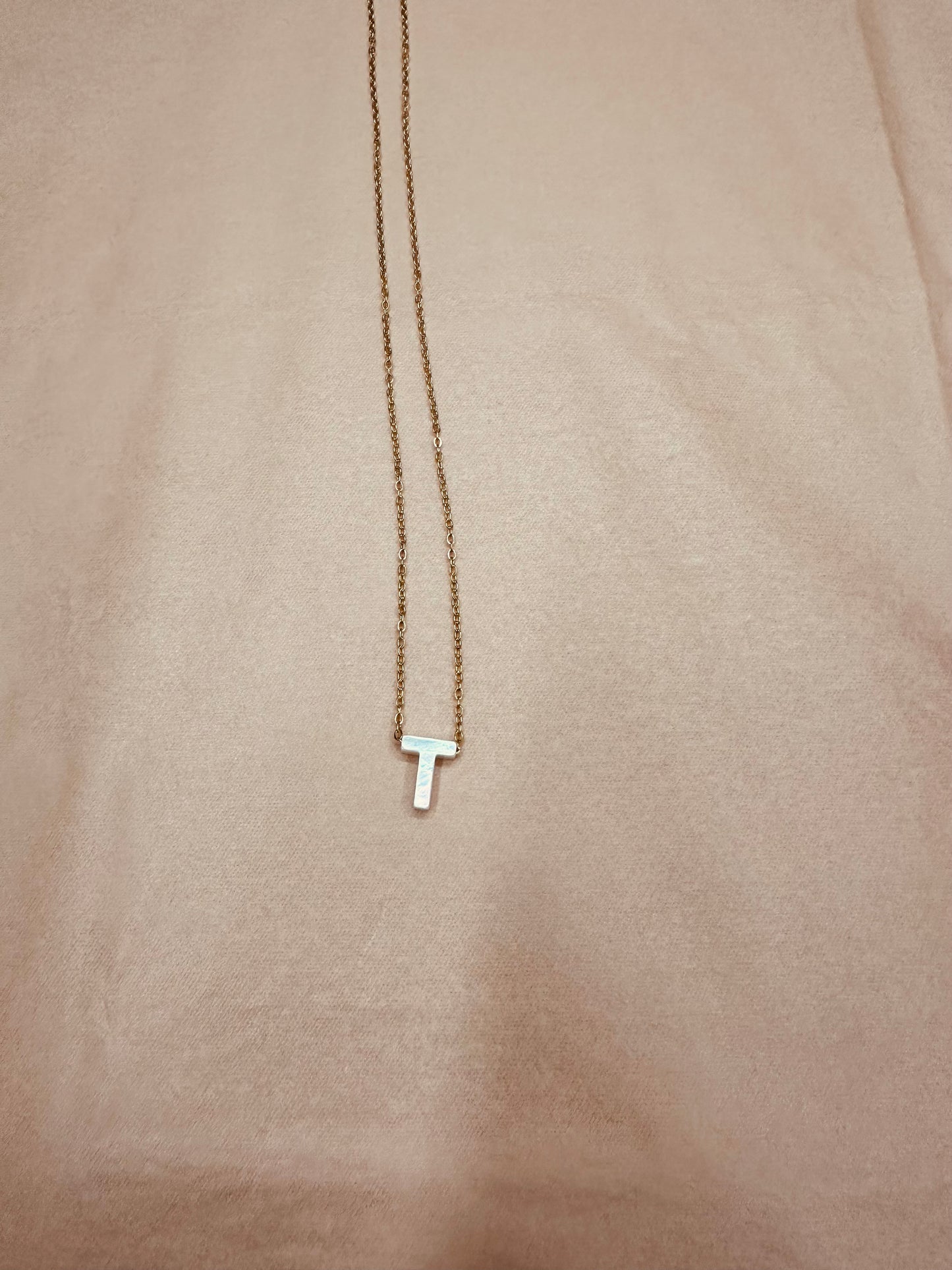 Inicial "T"