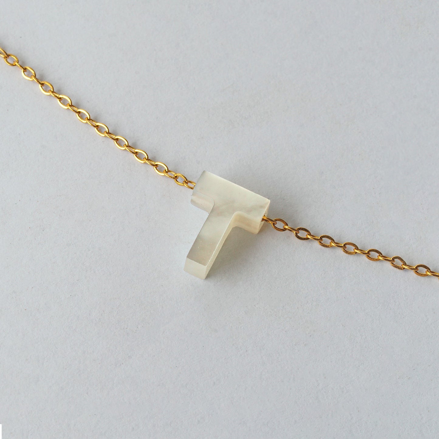 Inicial "T"